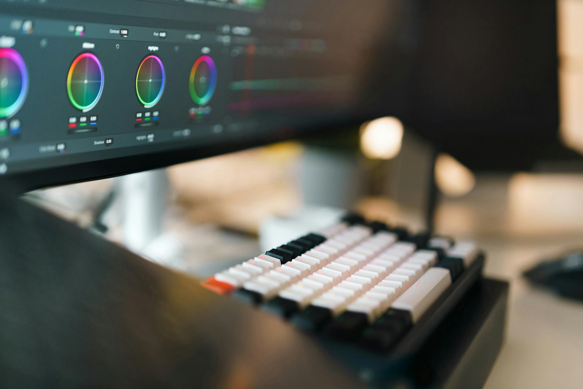 DaVinci Resolve color grading workspace with multiple monitors
